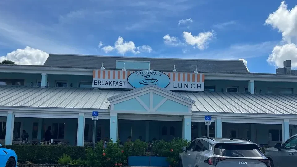 The Doreen's Cup of Joe storefront on Marco Island, with its Breakfast and Lunch awning sign.